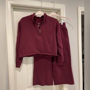 Girlfriend Collective matching sweatsuit set. Wide leg and half zip. Wine color